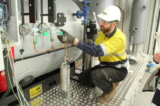 Trainee inspecting boiler gauge glass assembly