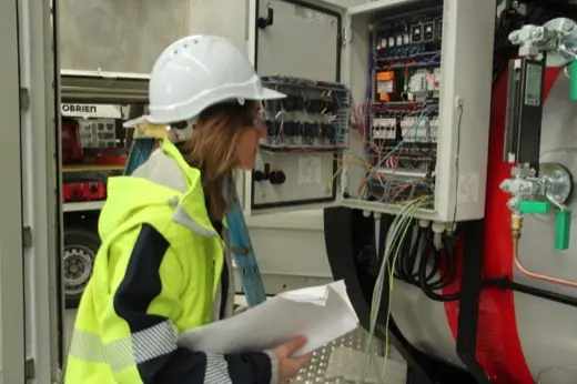 Checking electrical wiring inside the boiler control cabinet
